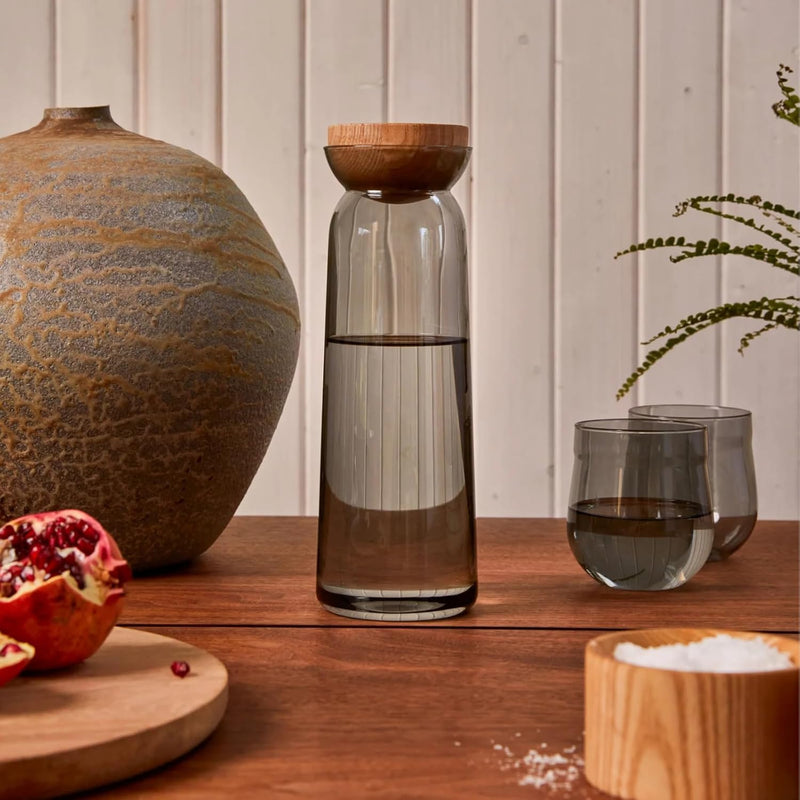 Holcomb Studio Teeter Carafe, Clear | Hand-Blown Glass Beverage Pitcher with Ash Wood Top | Modern Carafe for Water, Juice, or Cocktails | Elegant Serveware & Hostess Gift Home Décor Accent 10.4"H